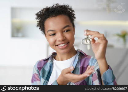 Smiling young biracial girl tenant shows house key to new home, first apartment. Happy mixed race teen lady houseowner renter tenant holding bunch of keys. Real estate rental service advertisement.. Happy young biracial girl tenant show house key to new home. Real estate rental service, relocation