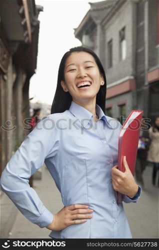 Smiling young business woman in houhai, Beijing, China