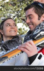 smiling young couple at ski