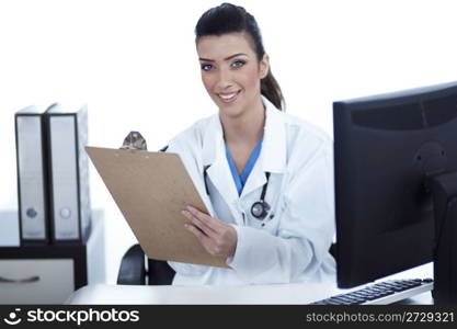 Smiling young doctor with clipboard in hand looking at the camera over white background