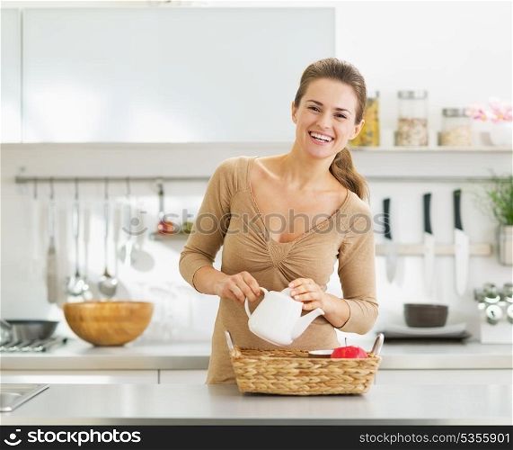 Smiling young housewife serving breakfast tray