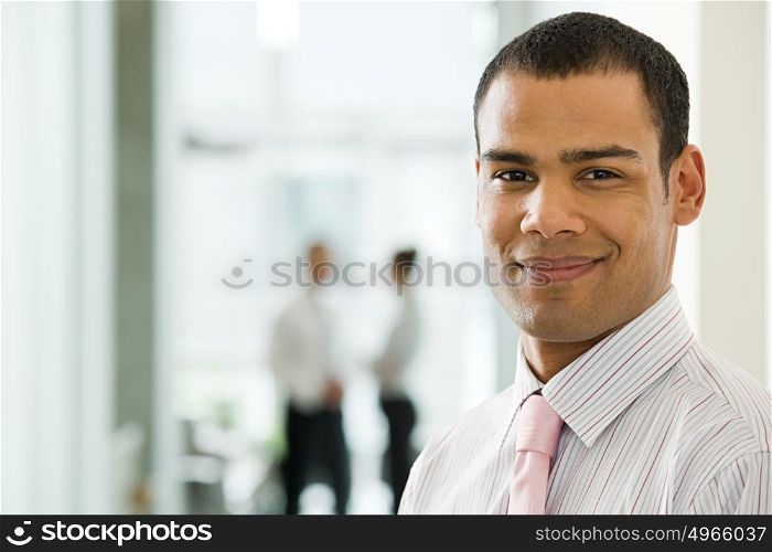 Smiling young male office worker