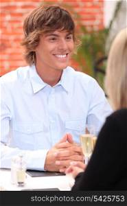 Smiling young man in a restaurant