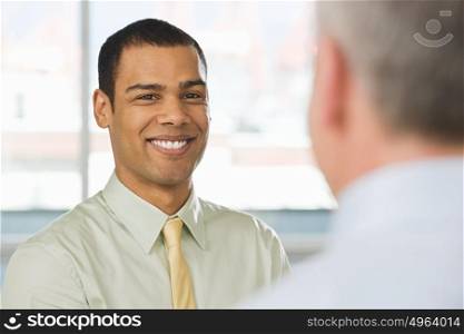 Smiling young man in an interview