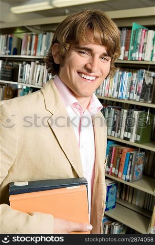 Smiling Young Man in Library
