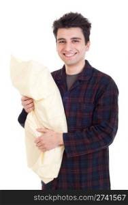 smiling young man in pajamas holding pillow isolated on white background