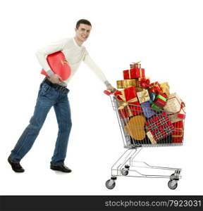 Smiling Young Man Showing Dollars and Shopping Cart Full of of Gifts and Boxes of Different Shapes and Colors on the White Background