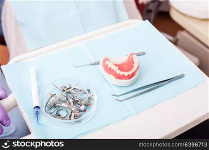 Smiling young man waiting for a dental exam at a dentist&rsquo;s office. The concept of healthcare