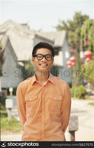 Smiling Young Man with Glasses in Nanluoguxiang, Beijing, China