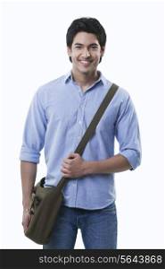 Smiling young man with shoulder bag