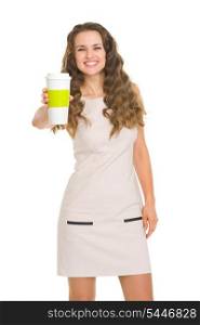 Smiling young woman giving coffee cup