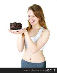 Smiling young woman holding a delicious chocolate cake