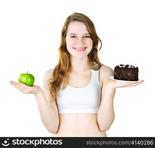 Smiling young woman holding apple and chocolate cake