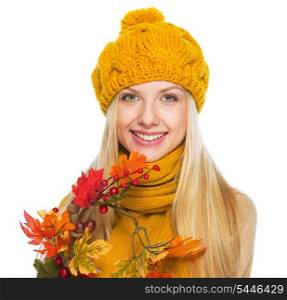 Smiling young woman holding autumn bouquet