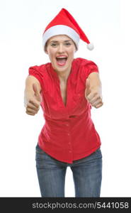 Smiling young woman in Christmas hat showing thumbs up