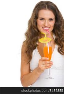 Smiling young woman in swimsuit drinking cocktail