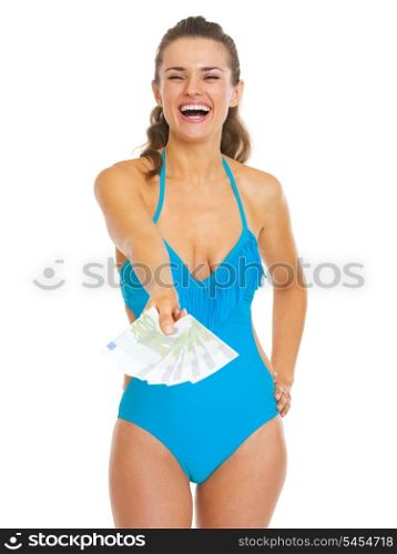 Smiling young woman in swimsuit giving fan of euros