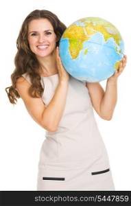 Smiling young woman looking out from earth globe