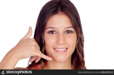 "Smiling young woman making the gesture of "Call me" isolated on white background"