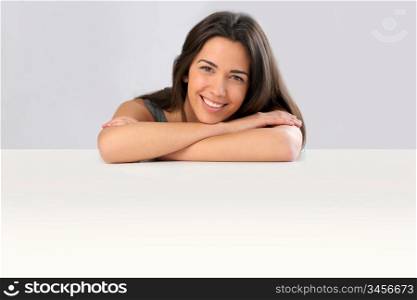 Smiling young woman on white background