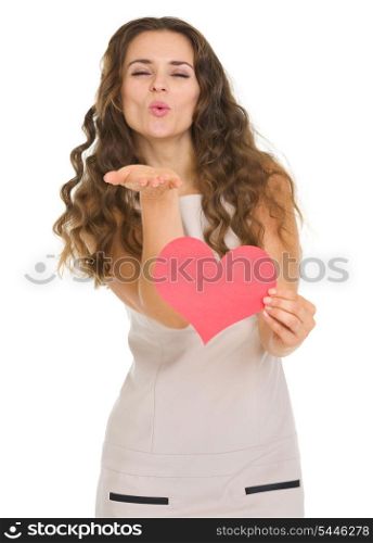 Smiling young woman showing valentine&rsquo;s day cards and blowing kiss