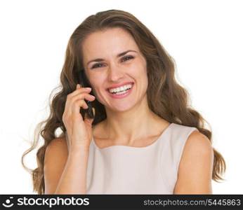 Smiling young woman talking mobile phone