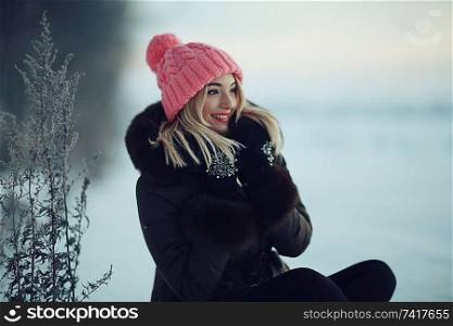 smiling young woman winter cold day nature