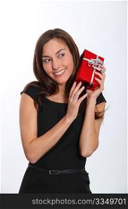 Smiling young woman with christmas gift