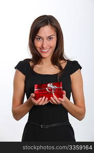 Smiling young woman with christmas gift