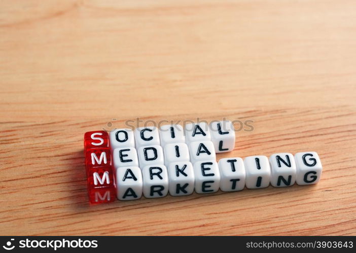 SMM Social Media Marketing written on dices on wooden background