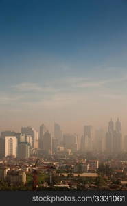 Smog dome and dust during sunrise in a very polluted city - in this case Jakarta, Indonesia