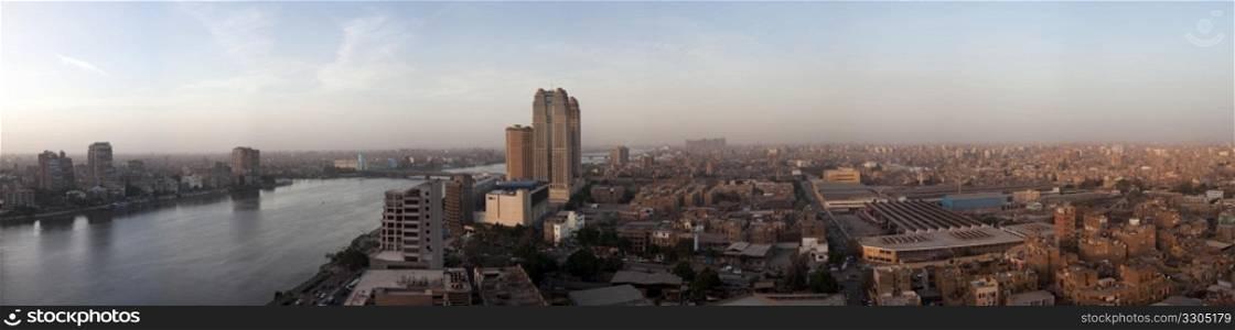 Smoggy evening panorama across Cairo in Egypt with the river Nile