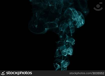Smoke. abstract forms created with blue smoke isolated background