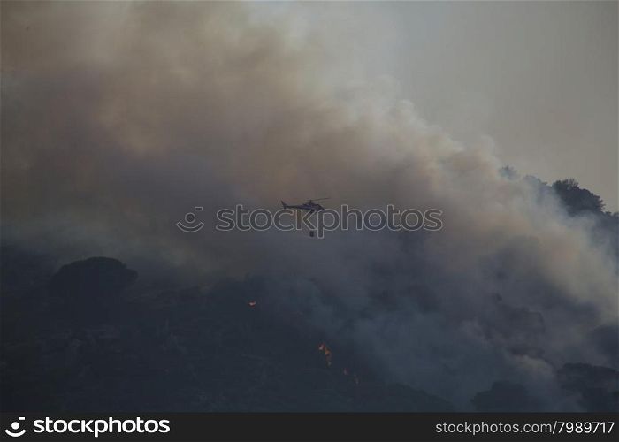 Smoke and a forest fire in Sardinia