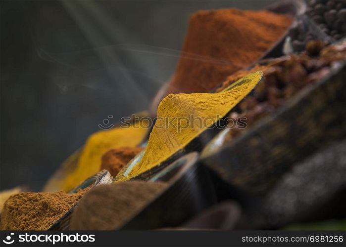 Smoke, Aromatic spices on wooden background