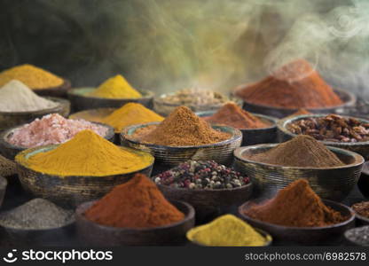 Smoke, Aromatic spices on wooden background