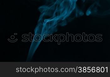 Smoke blue light on black background.
