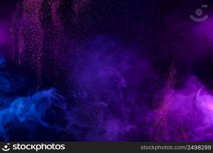 Smoke colorful clouds and shiny glitter bursts. Abstract outer space fairy tale background.