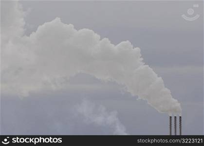 Smoke coming out of a chimney in Alberta Canada