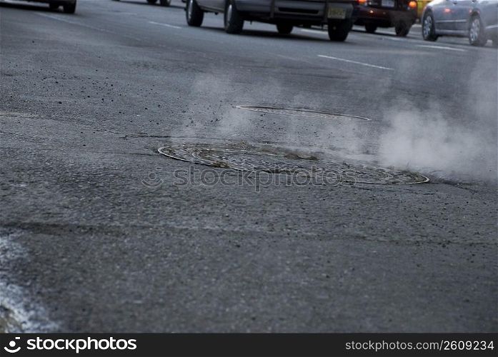 Smoke coming out of a manhole