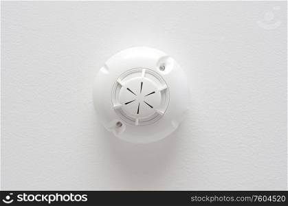 smoke detector on a white ceiling hotel room security