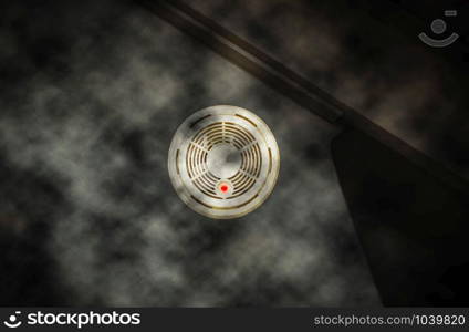 Smoke detector on the wall with red warning light sensor and smoke. fire concept, House on fire Dark. Smoke detector on the wall with red warning light sensor and smoke. fire concept house on fire