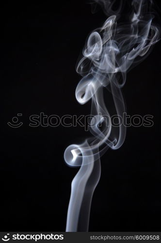 smoke from a cigarette in a black background