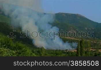 Smoke from a mountain forest fire