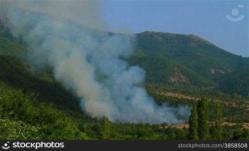 Smoke from a mountain forest fire