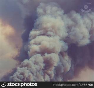 smoke from the fire along road