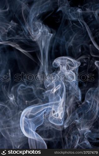 Smoke or Steam Rising against a Black Background