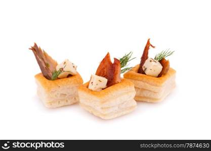 Smoked fish and feta cheese in pastries isolated on white background.
