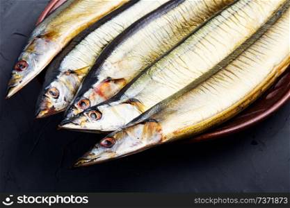 Smoked fish.Appetizing smoked fish.Hot smoked fresh fish. Hot smoked fish on plate
