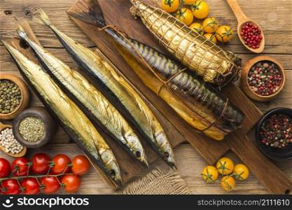 smoked fishes wooden table flat lay